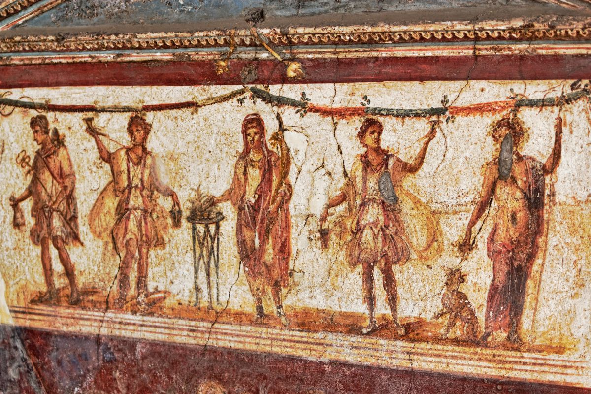 Eine antike Wandmalerei in einem Haus in Pompei.